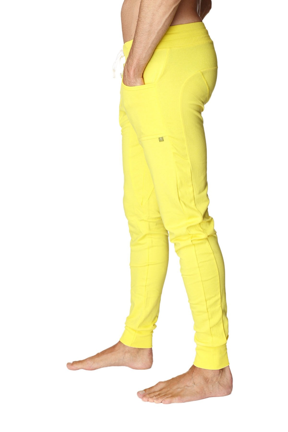 Long cuffed jogger and yoga sweat pants in bright tropic yellow with drawstring waist and subtle side pockets