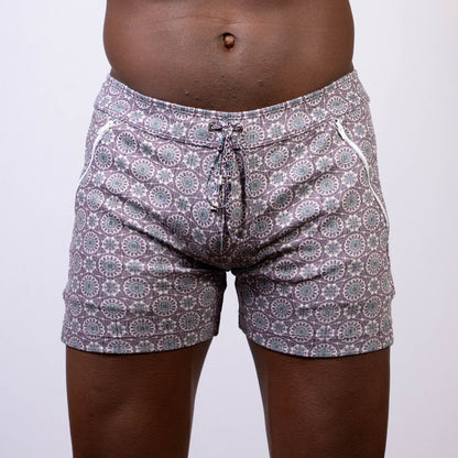 Gray and white mandala linen texture shorts with circular floral design and side zipper pockets for swimwear use