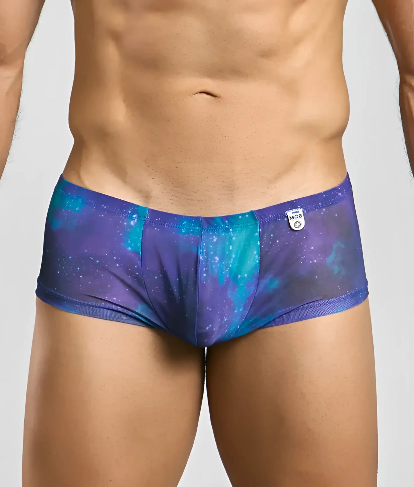 Mob men’s sexy sheer hip brief featuring purple and teal galaxy pattern with mesh trim in men’s briefs style