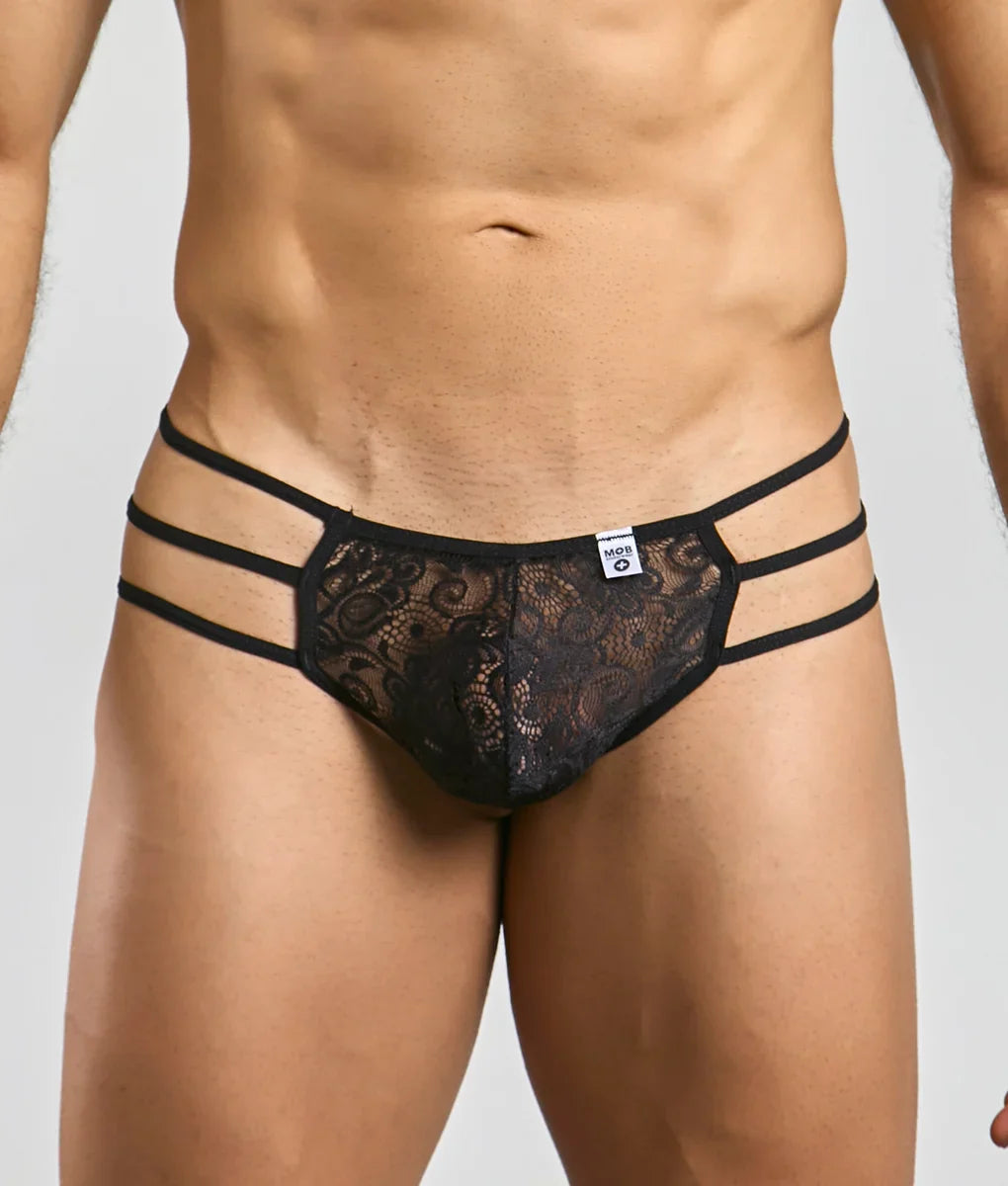 Mob men’s lace pouch thong in black lace with three horizontal elastic straps front view