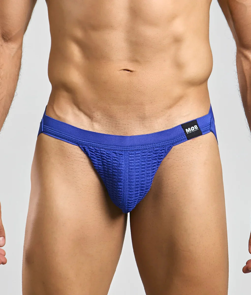 Blue textured athletic briefs with black mob brand tag on waistband designed as mob swim jockstrap