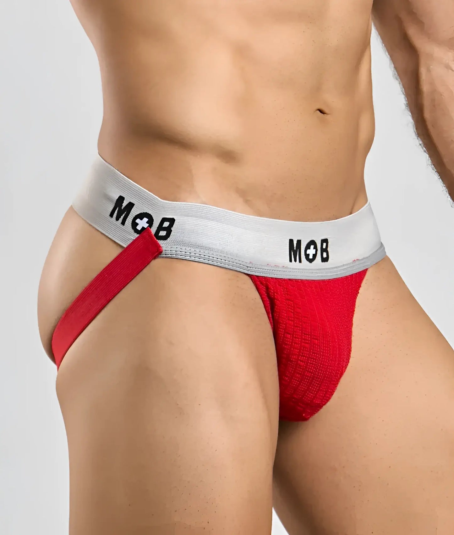 Red textured briefs with a gray waistband featuring the mob logo in black from the mob classic jock 3 inches line