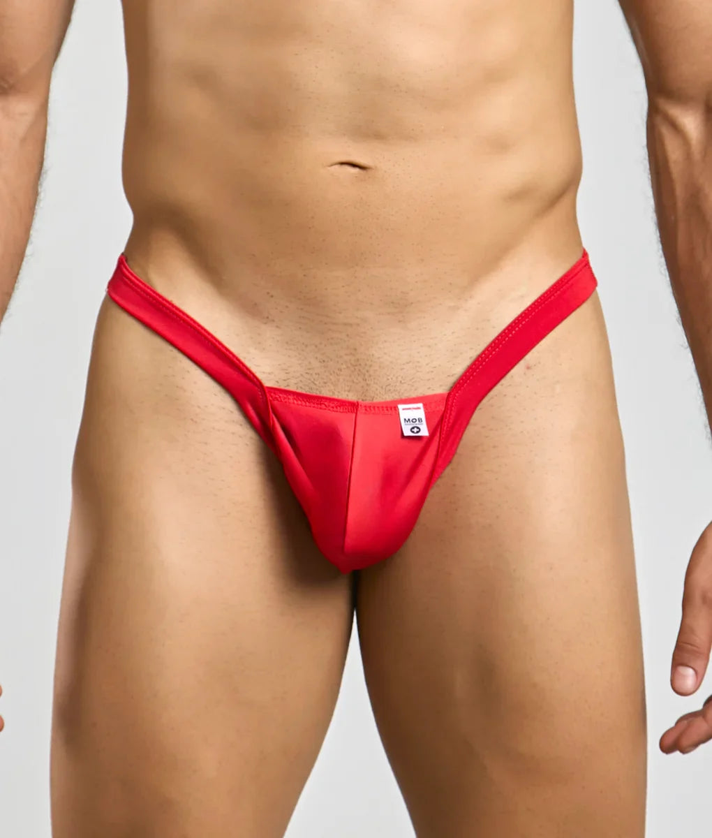 Red thong mob y buns thong with a small white tag at the center front made from soft breathable fabric