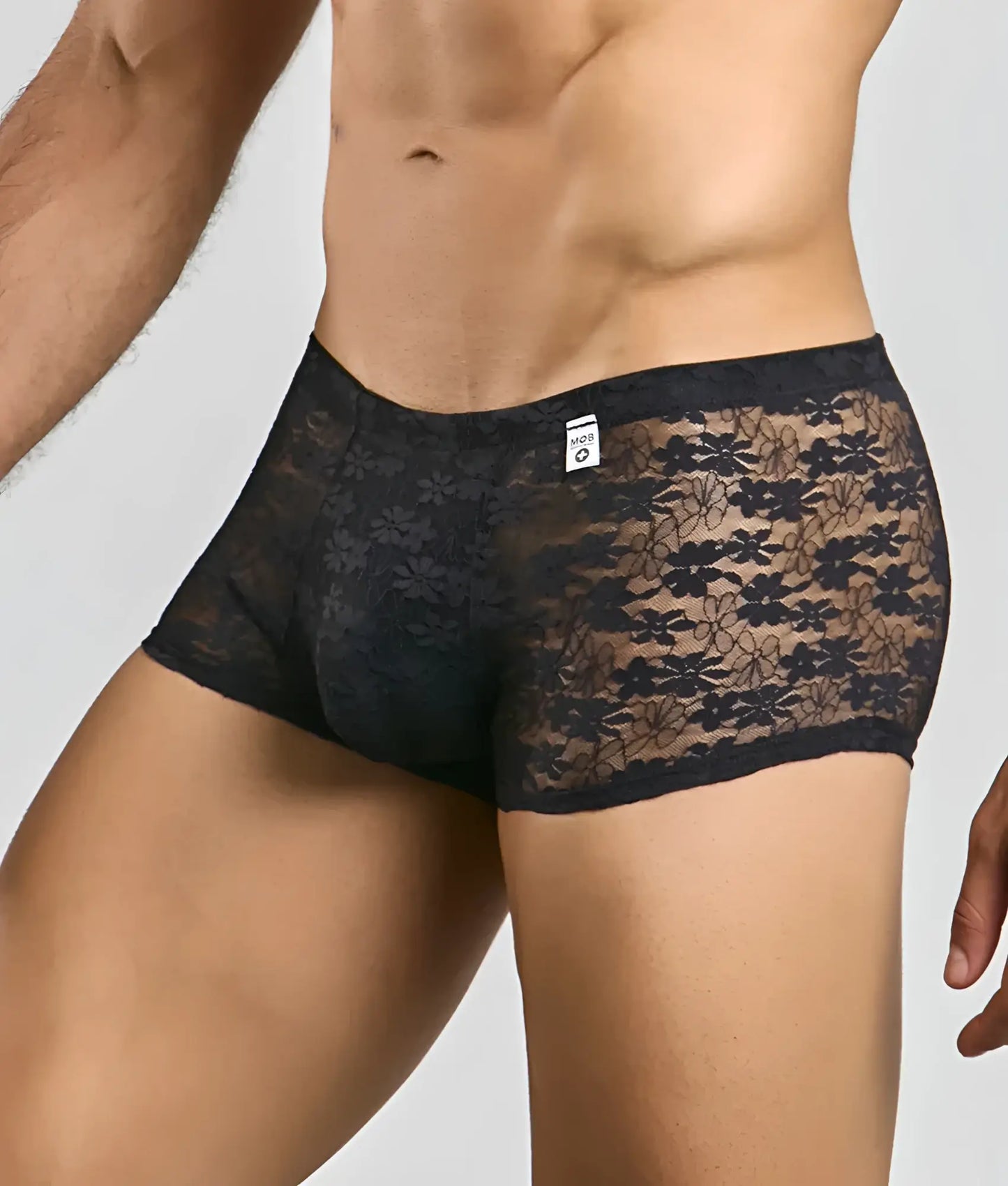 Black floral lace men’s mesh lace pouch trunk briefs with sheer patterned design and solid waistband