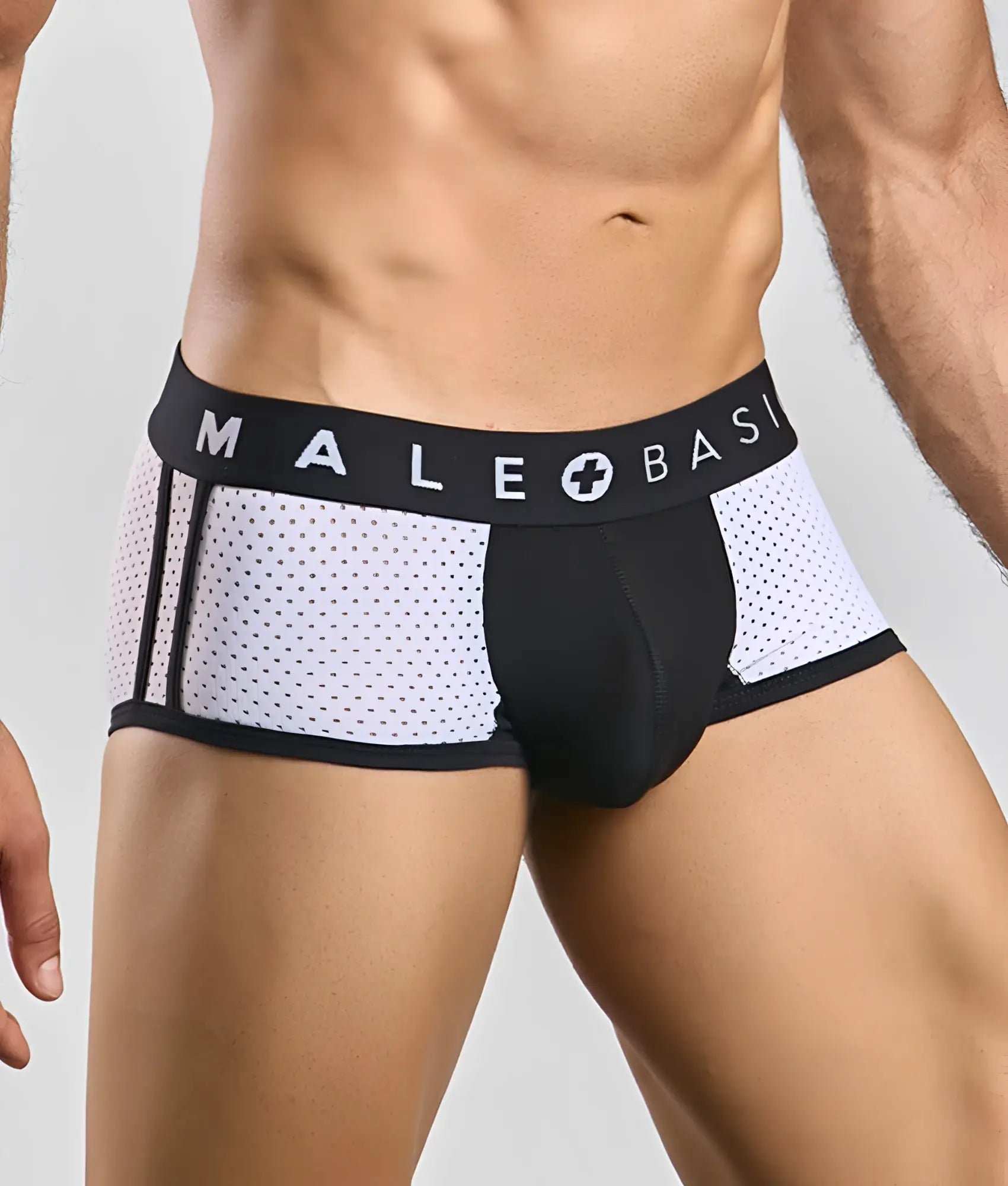 Black and white mesh athletic briefs with a branded waistband from Malebasics Spot New Sexier Trunk Pink collection
