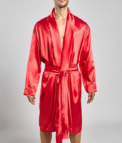 A vibrant red satin robe with a matching belt and long sleeves in a classic wrap design by malebasics