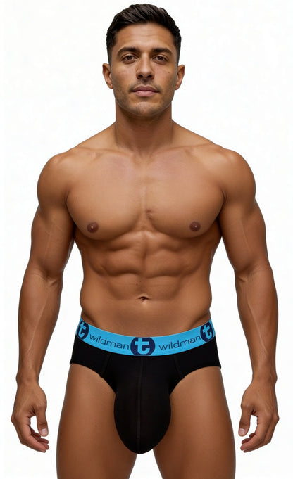 A fit man wearing WildmanT black cotton briefs with a bright blue elastic waistband featuring the brand logo.