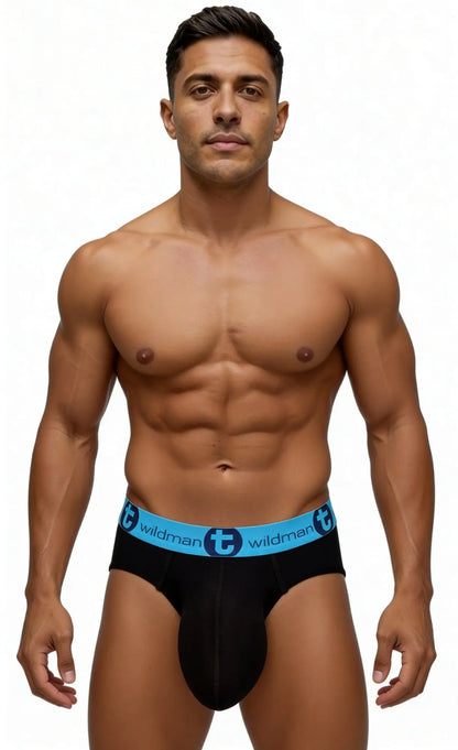 A fit man wearing WildmanT black cotton briefs with a bright blue elastic waistband featuring the brand logo.