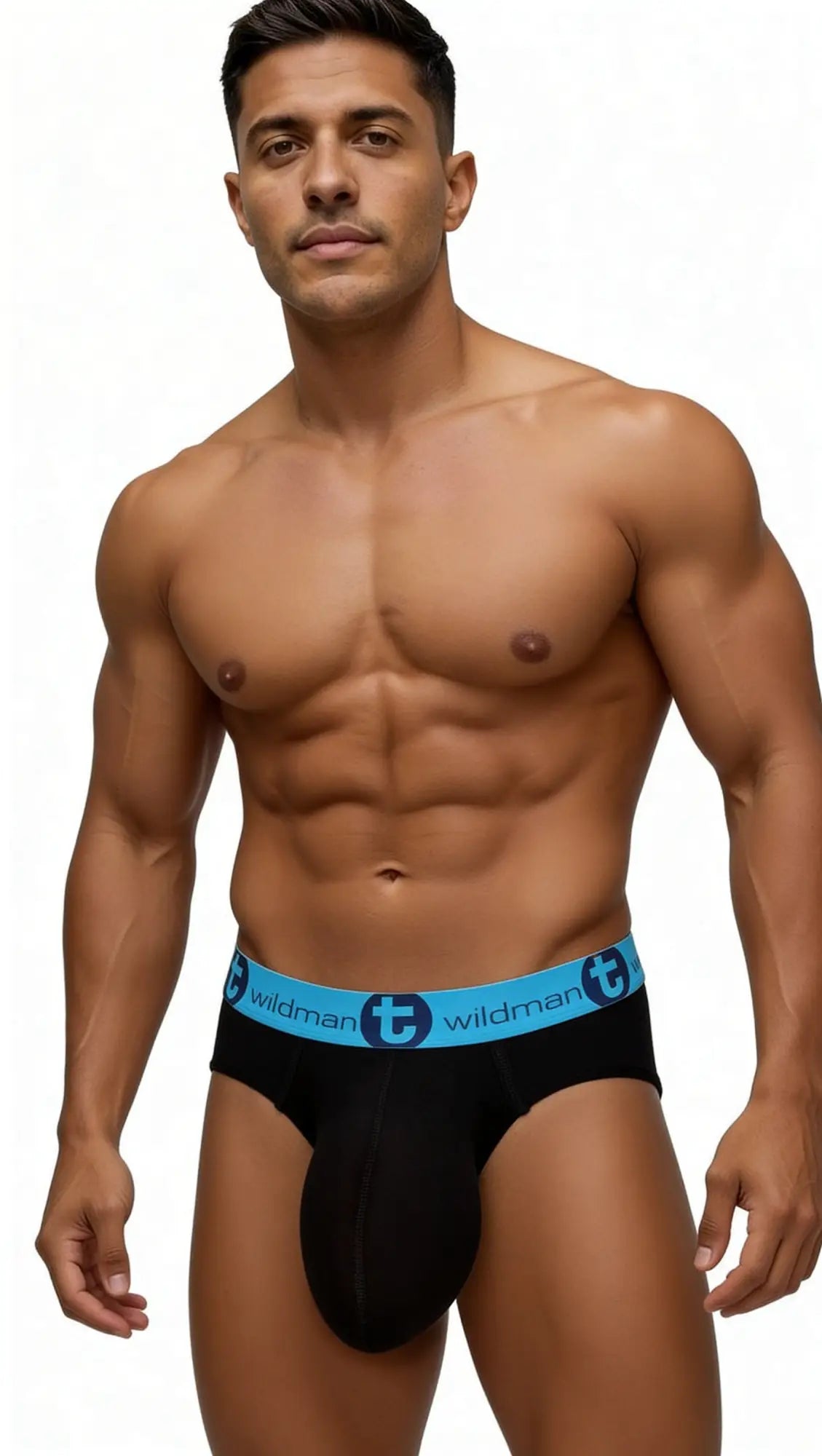 Muscular man wearing WildmanT black cotton briefs with a bright blue waistband featuring the brand logo.