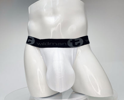 White cotton jockstrap with a large, contoured pouch and a black waistband featuring "WildmanT" branding.