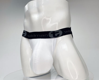 White jockstrap with a contoured pouch on a white mannequin, featuring a black waistband with "wildmanT" branding.