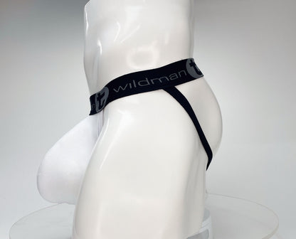 White WildmanT cotton jockstrap with a contoured pouch and black branded waistband on a mannequin.