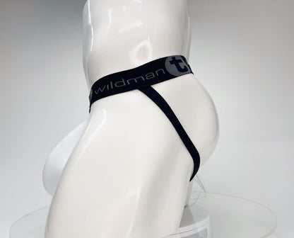 White jockstrap with a black waistband featuring the "WildmanT" logo on a mannequin torso, side profile view.