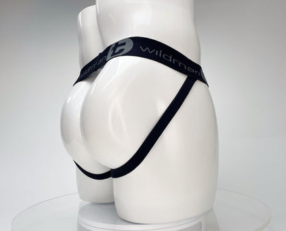 White WildmanT jockstrap on a mannequin, featuring a black branded elastic waistband and side straps.