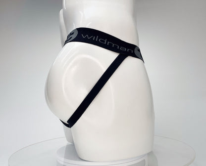 White mannequin wearing a black WildmanT jockstrap with branded elastic waistband on a white background.
