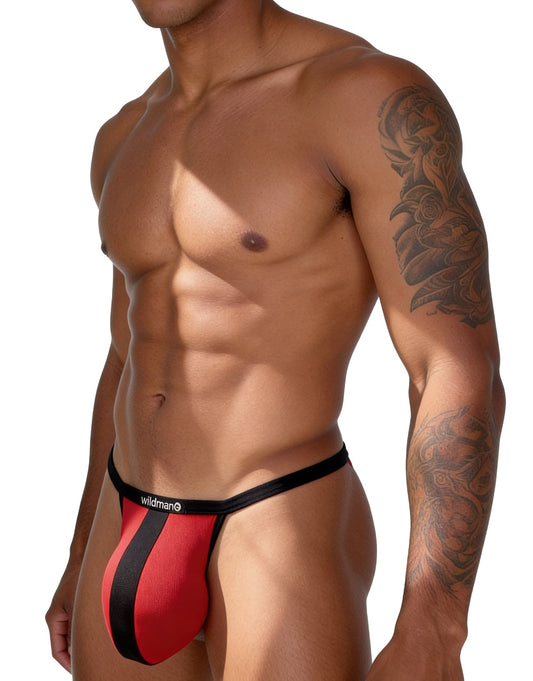 Red mesh thong with a vertical black stripe and black waistband featuring the "Wildman" logo on a fit, tattooed man.