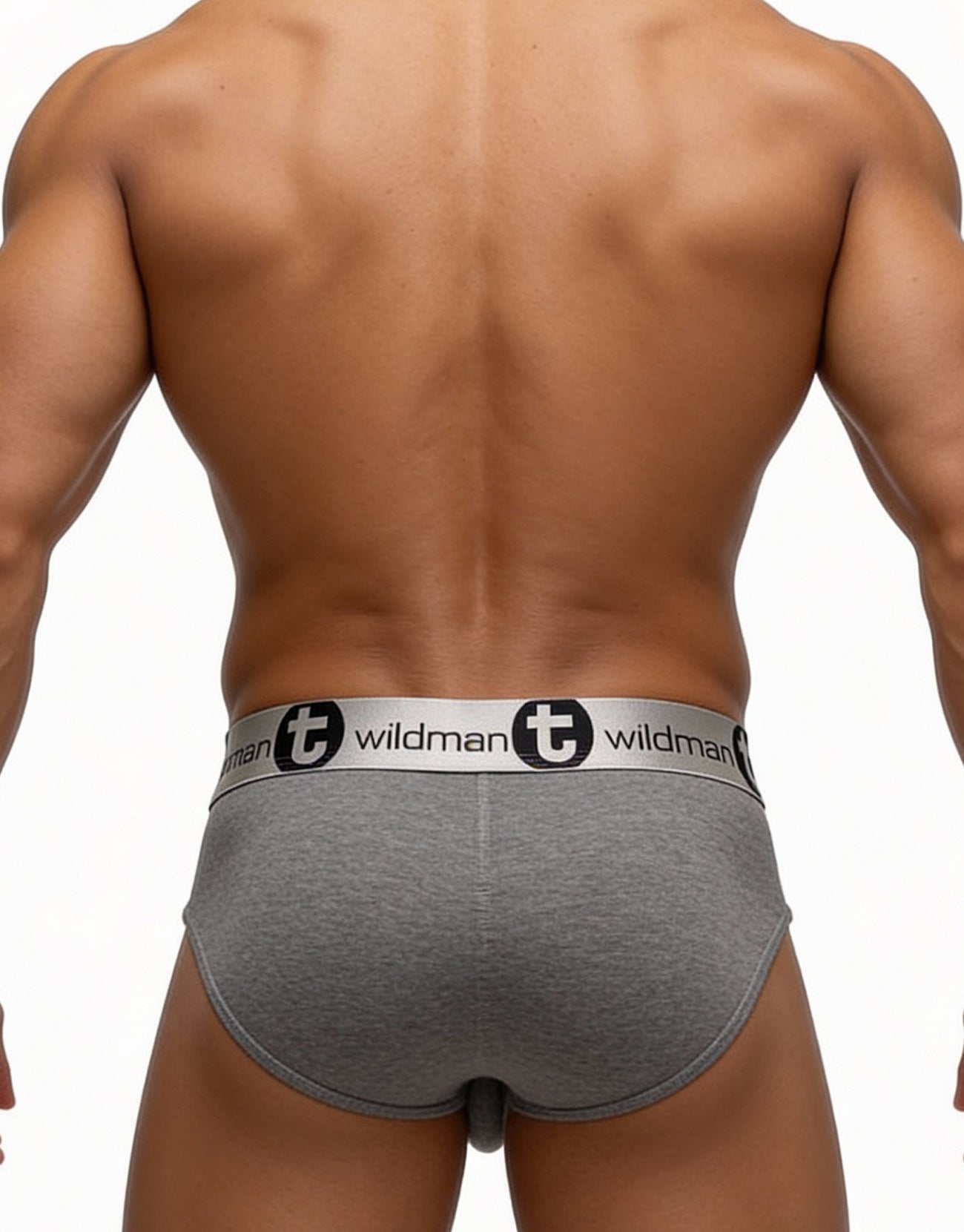 Rear view of muscular man wearing gray WildmanT modal briefs with branded silver waistband.