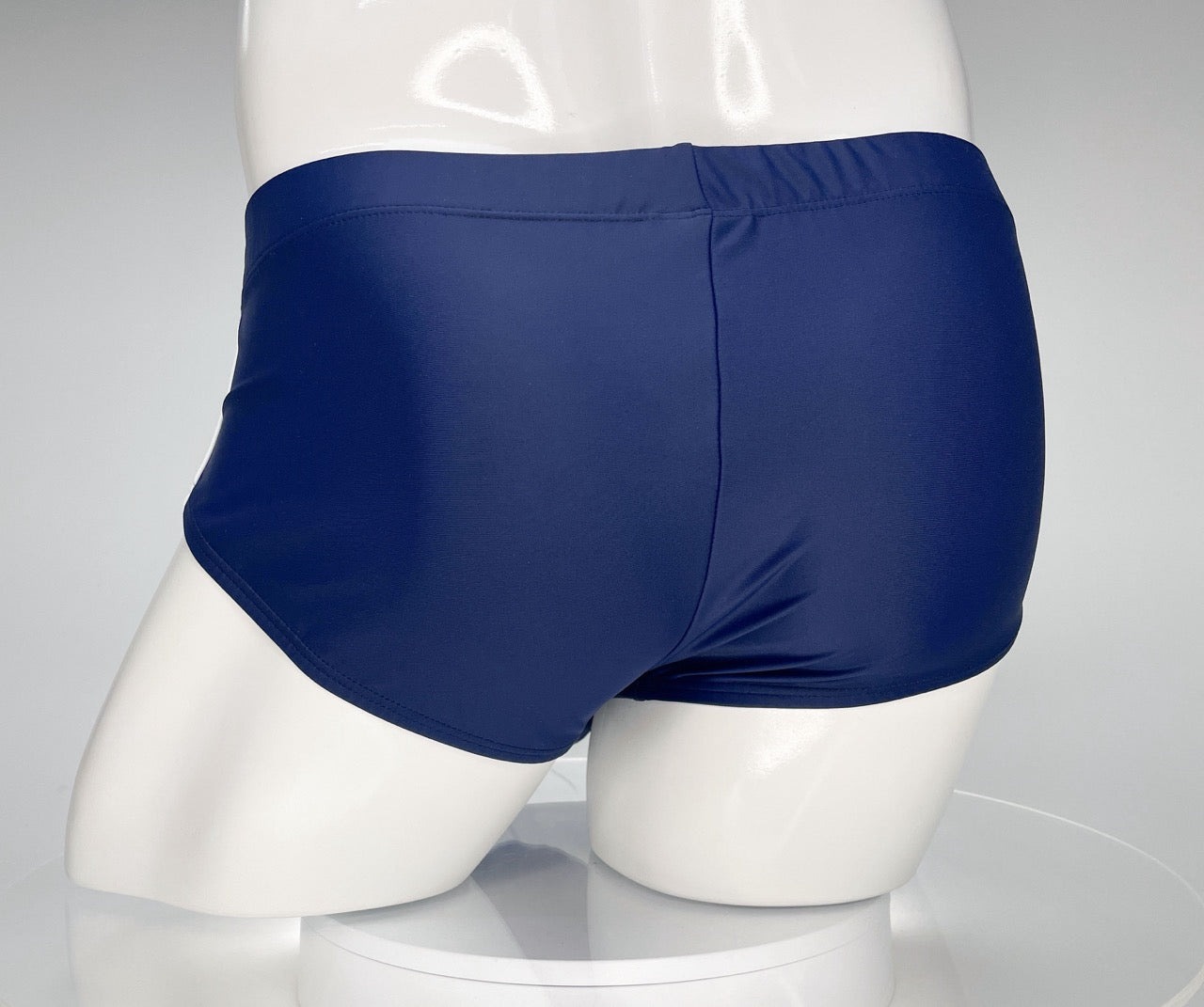 Back view of WildmanT navy blue swim brief on a white mannequin.