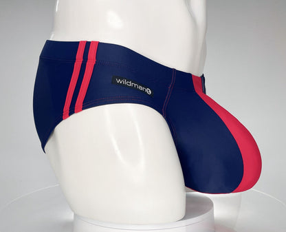 WildmanT navy and red swim brief with dual side stripes and a contoured pouch, modeled on a white mannequin.