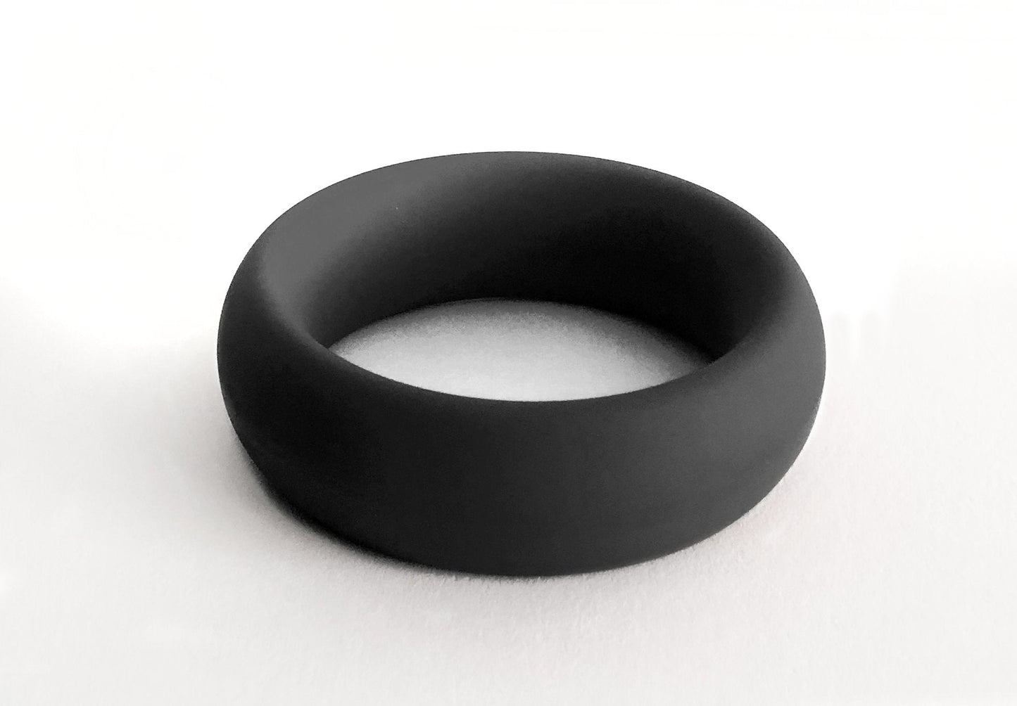 Black silicone meat rack ring with smooth matte finish and rounded edges for comfortable everyday wear