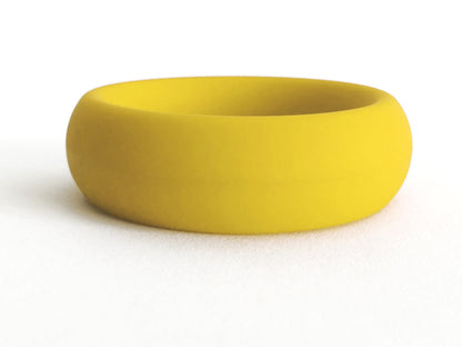 A smooth solid yellow silicone ring with a minimalist design from meat rack collection