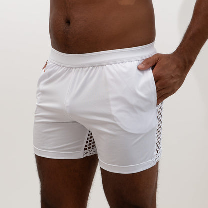 White athletic mesh back short featuring a solid fabric main body with a side mesh panel for breathability