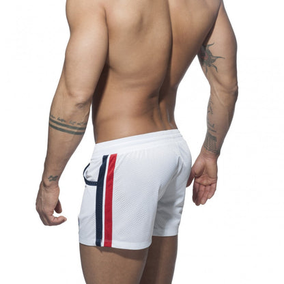 White mesh athletic shorts with bold red and navy blue vertical stripes down the side called mesh rainbow short