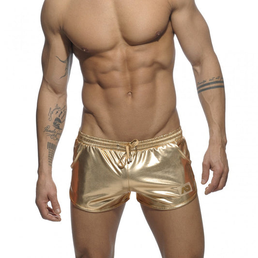 Shiny gold metallic swim trunks with drawstring waistband and side pockets in metallic short style