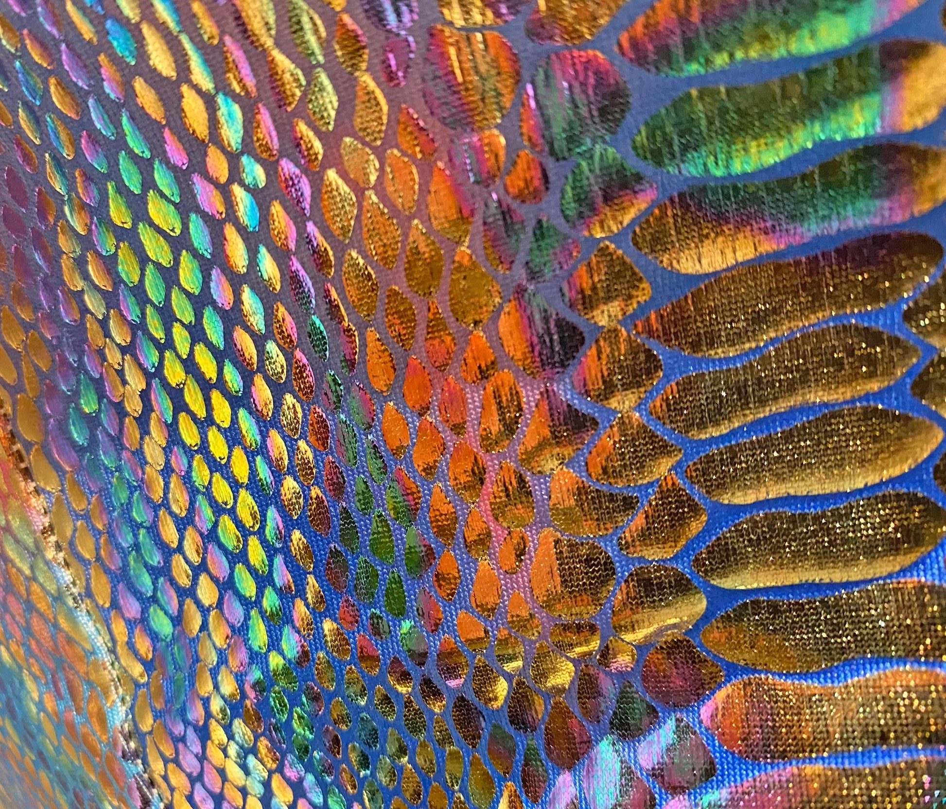 Metallic snake pocket shorts in iridescent holographic fabric with shimmering scale pattern in vibrant rainbow hues