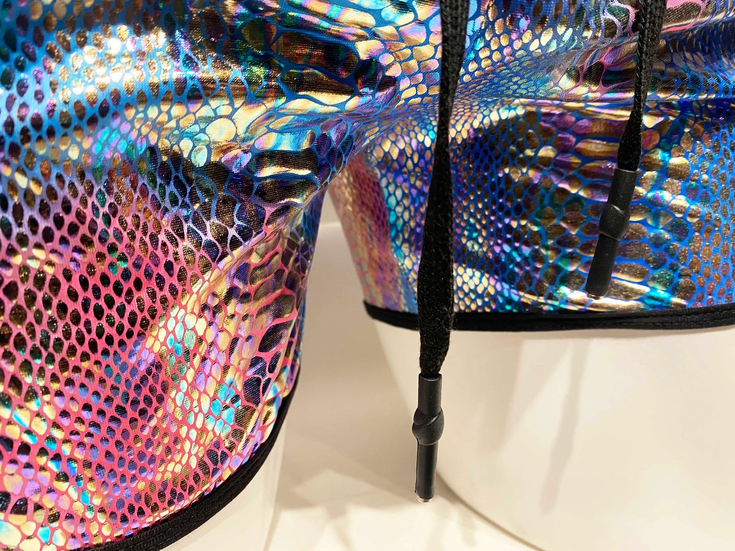 Metallic snake pocket shorts with iridescent snake-scale pattern and black drawstrings for a stylish look