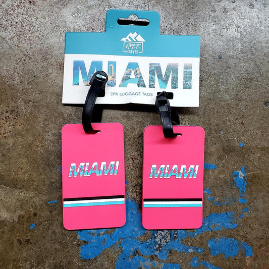 Bright pink rectangular miami luggage tags set of 2 with bold white letters and black blue turquoise stripes