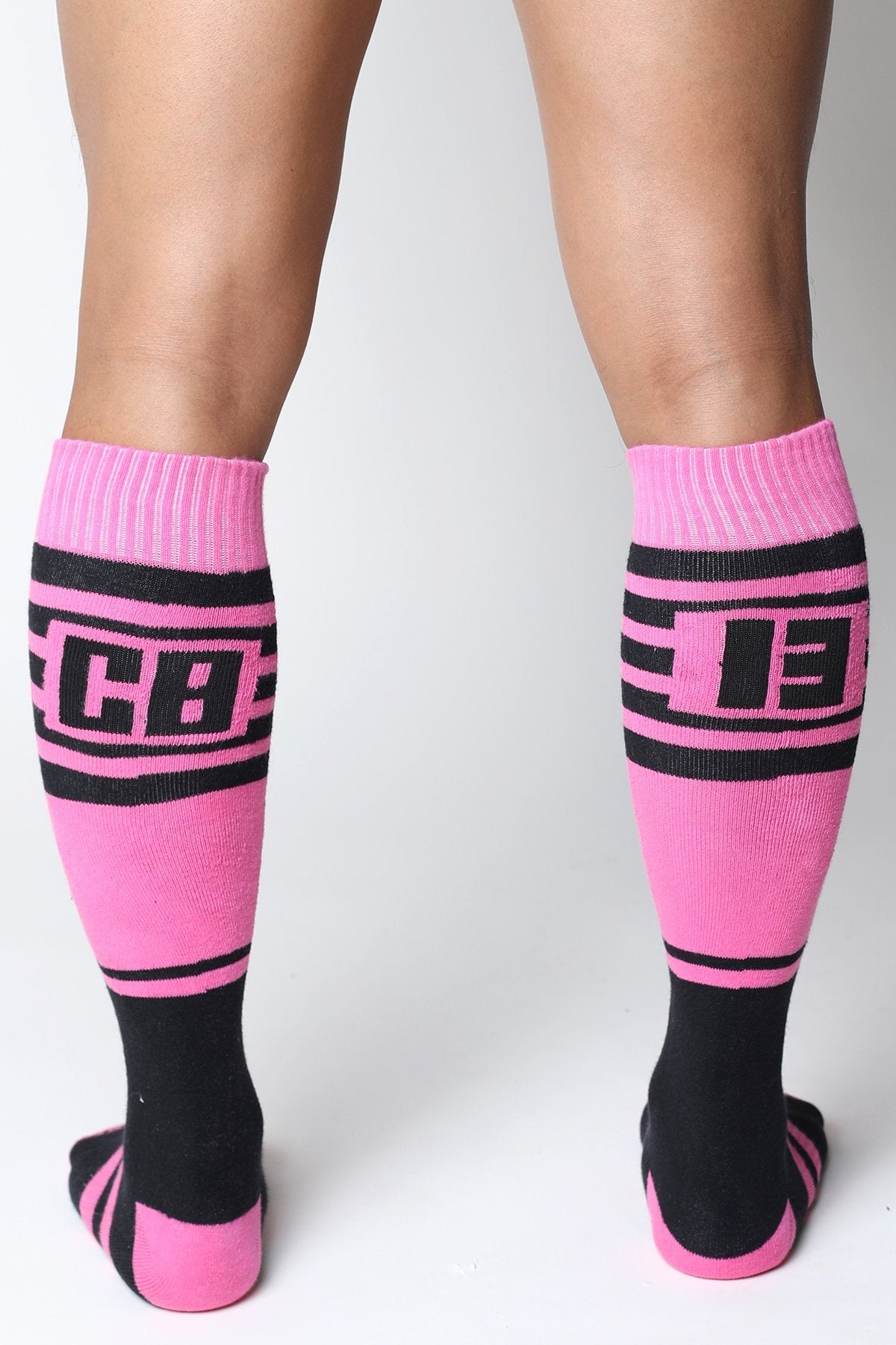 Midfield knee high socks in bright pink and black with bold cb lettering ribbed cuffs and toe accents