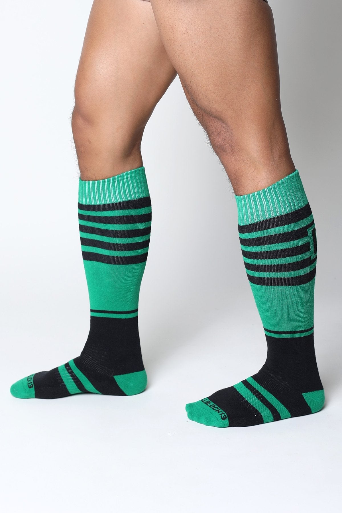 Midfield knee high sock in green and black stripes with ribbed cuffs for comfortable all-day wear