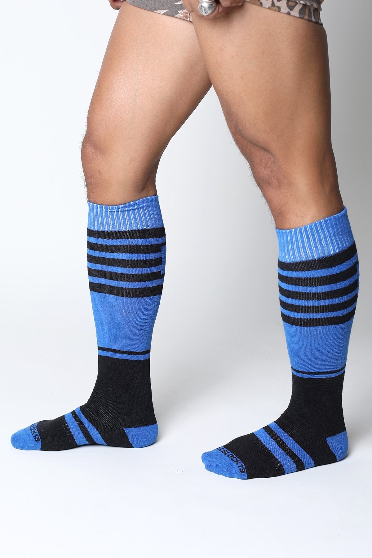 Midfield knee high sock in blue and black stripes with ribbed cuffs made for comfortable all day wear