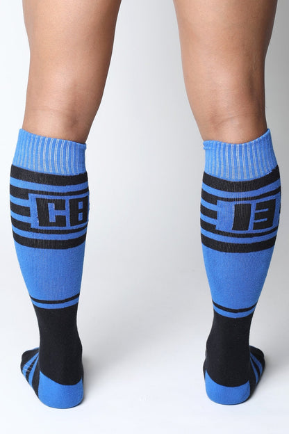 Midfield knee high blue and black athletic socks with bold cb logo designed for sports and active wear