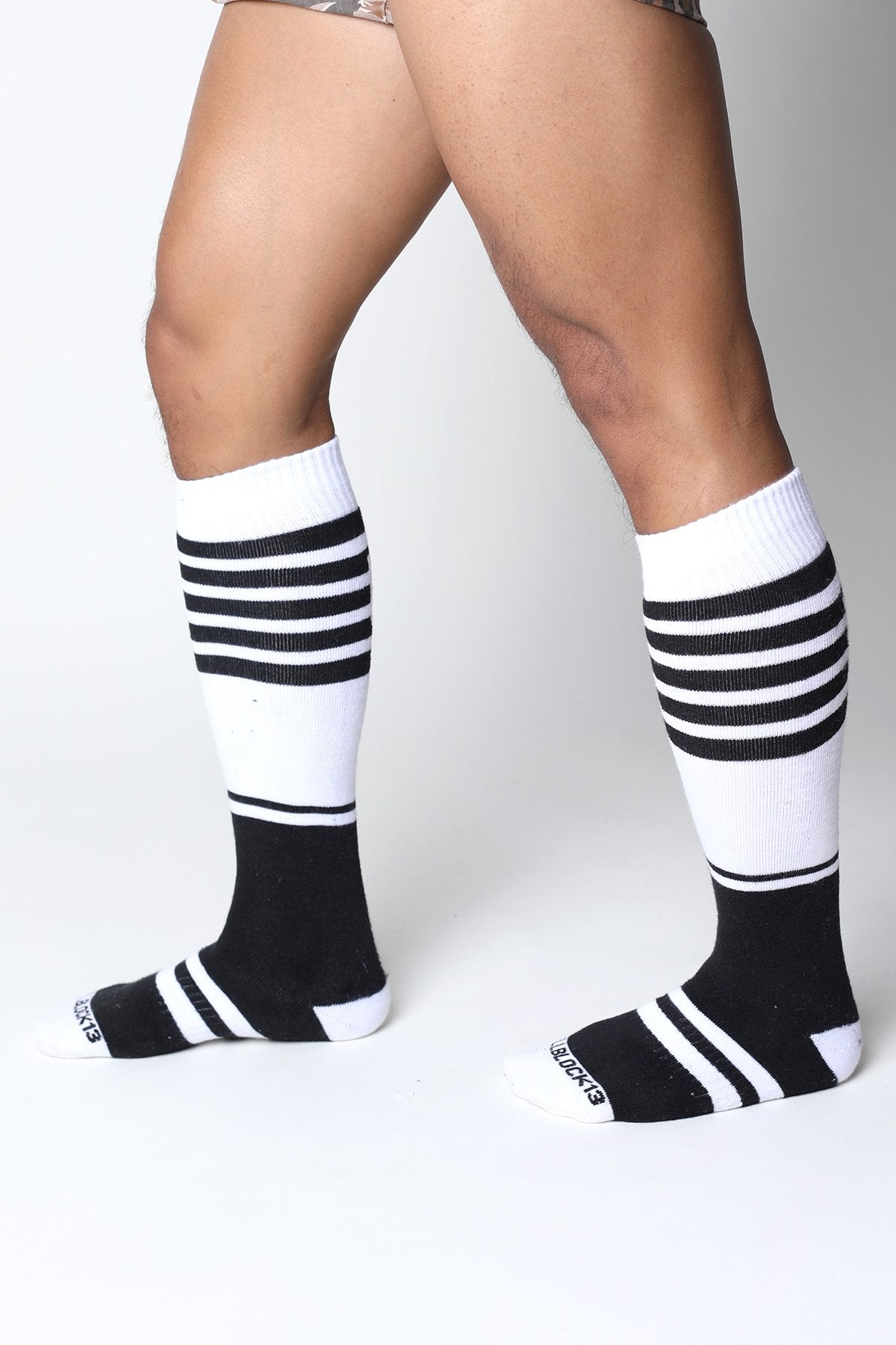 Black and white striped midfield knee high socks with ribbed texture in soft breathable fabric