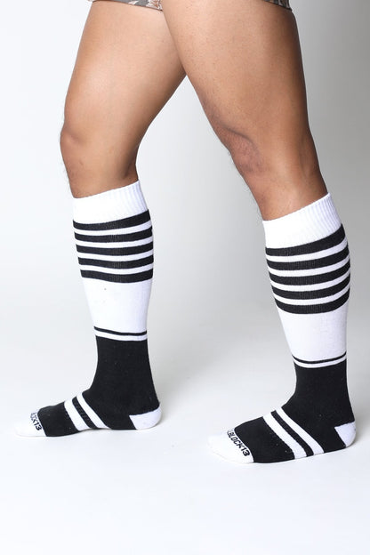 Black and white striped midfield knee high socks with ribbed texture in soft breathable fabric