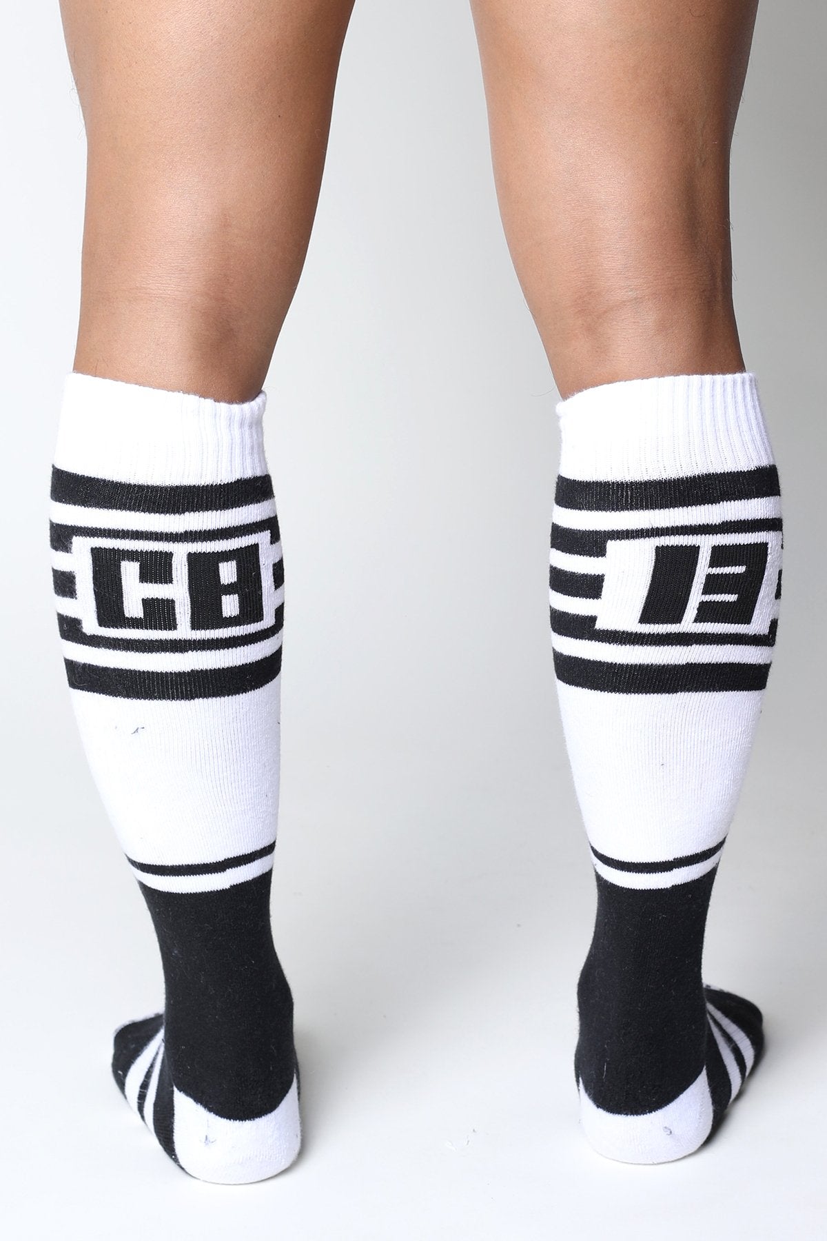 Black and white knee high socks with bold stripes and cb logo from the Midfield collection available in 7 colors