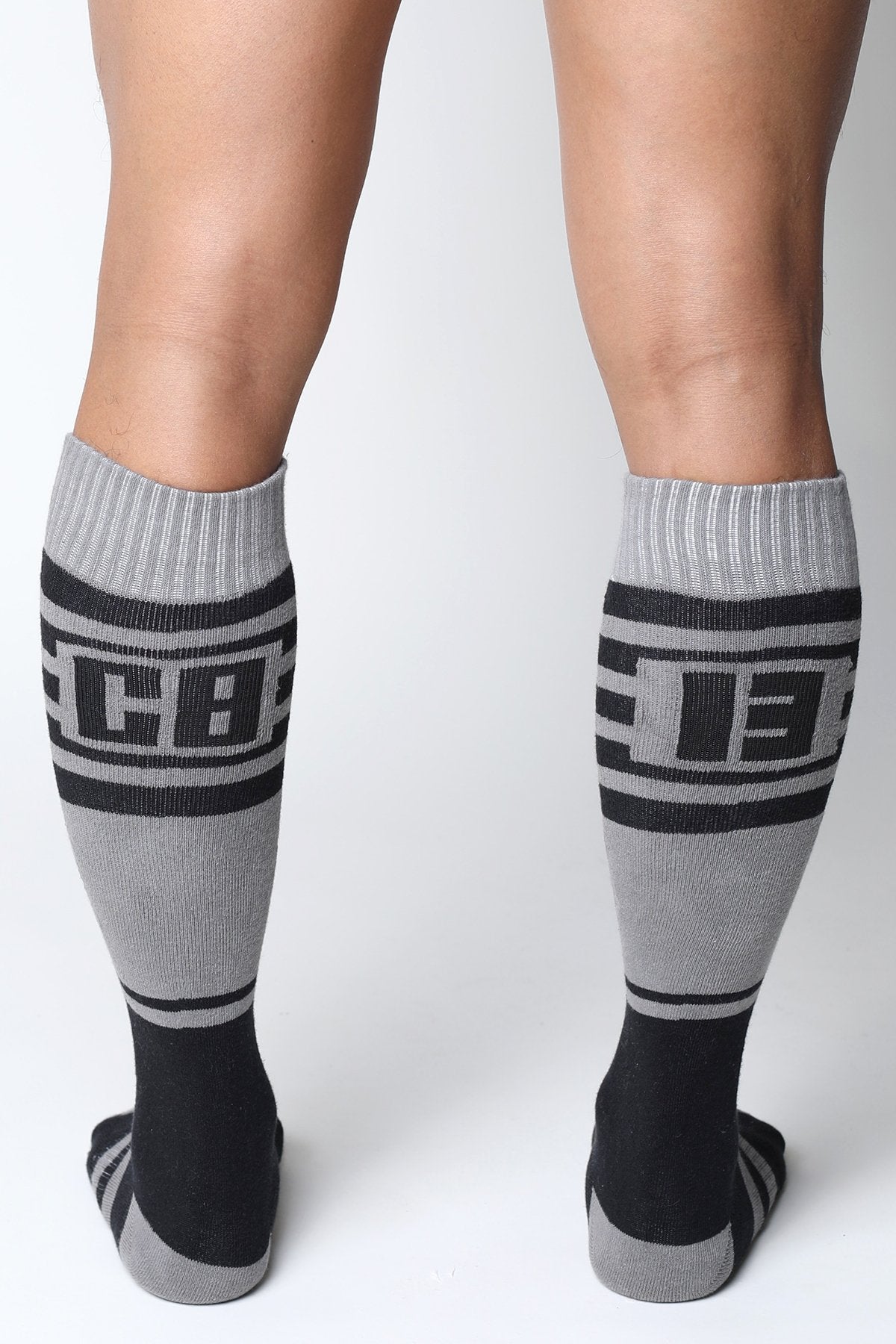 Midfield knee high socks in gray and black with bold cb lettering ribbed cuffs and toe accents