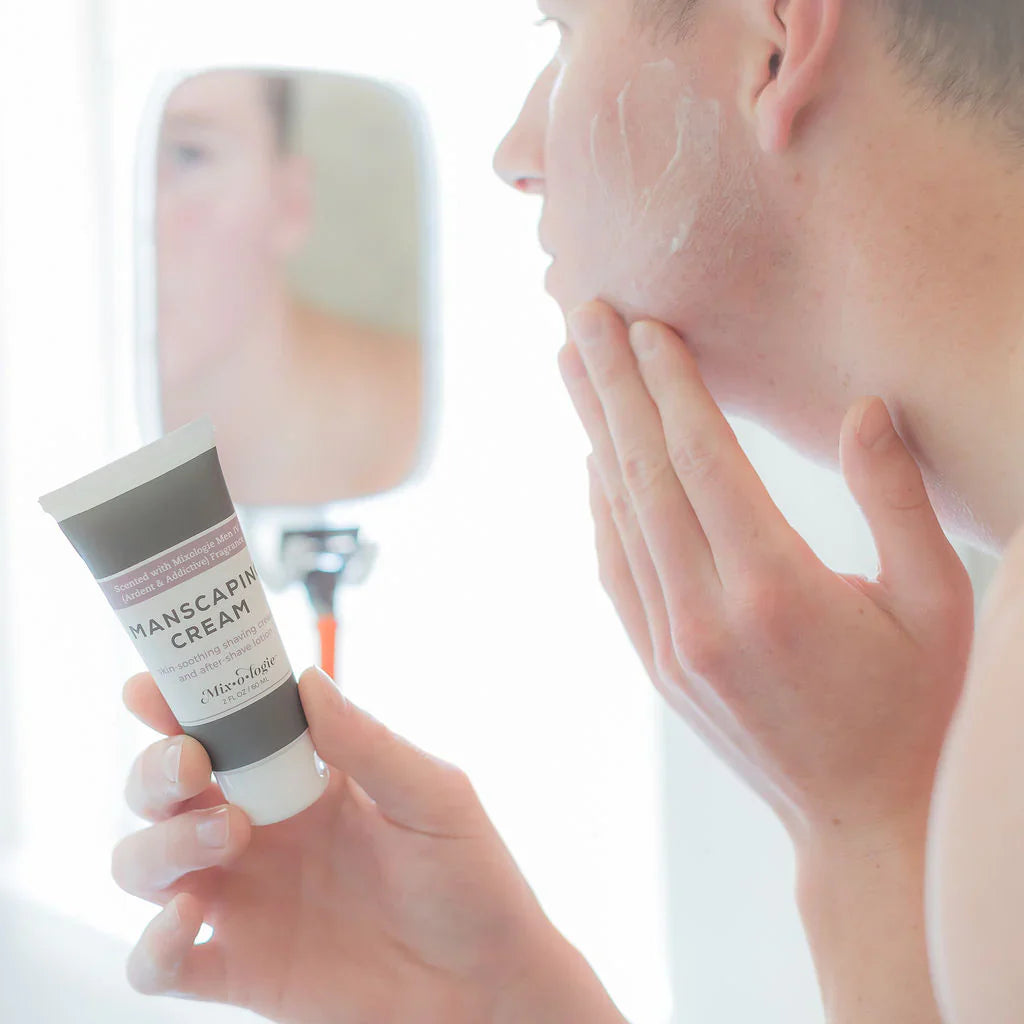 A sleek matte gray tube of vichy cologne manscaping cream shave lotion sent iv with a white cap and minimalist label