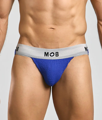 Blue textured briefs with a gray waistband featuring the mob logo from the mob classic jock 3 inches collection
