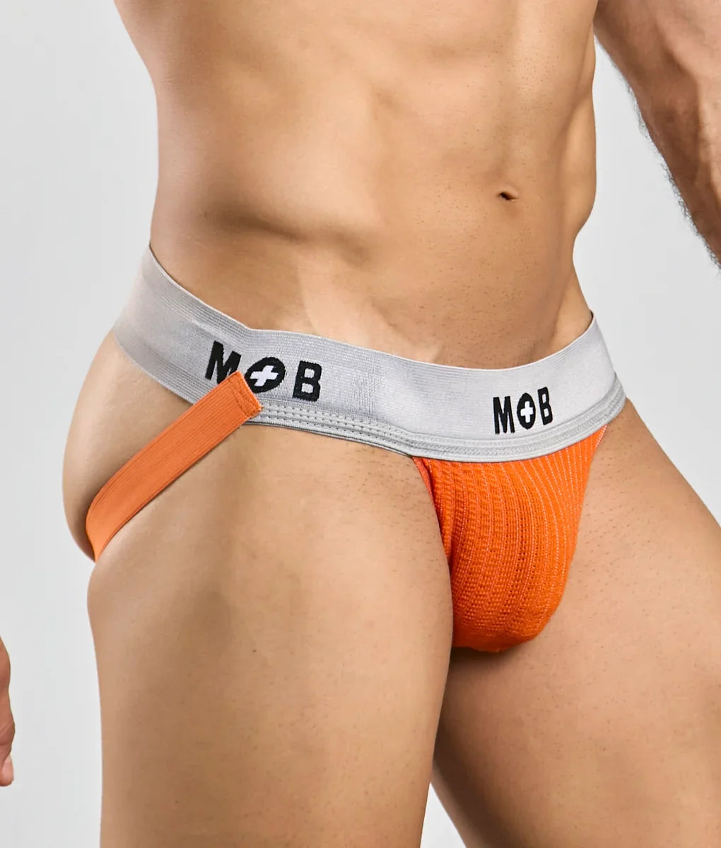 Orange knitted briefs with a gray waistband featuring the mob logo in black lettering from mob classic jock 3 inches