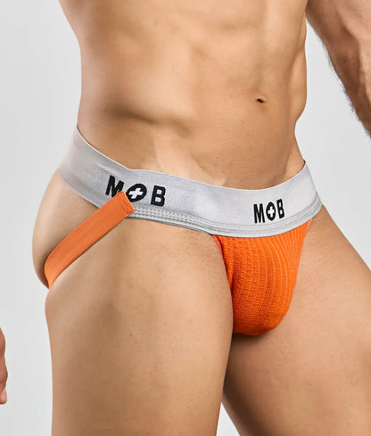 Orange knitted briefs with a gray waistband featuring the mob logo in black lettering from mob classic jock 3 inches