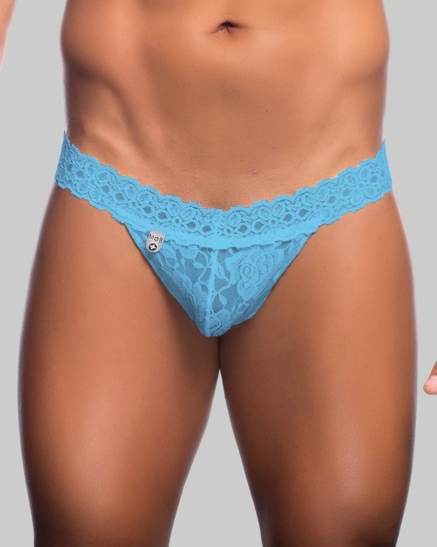 Light blue lace thong with delicate floral pattern and branded tag from mob mens lace waist thong collection