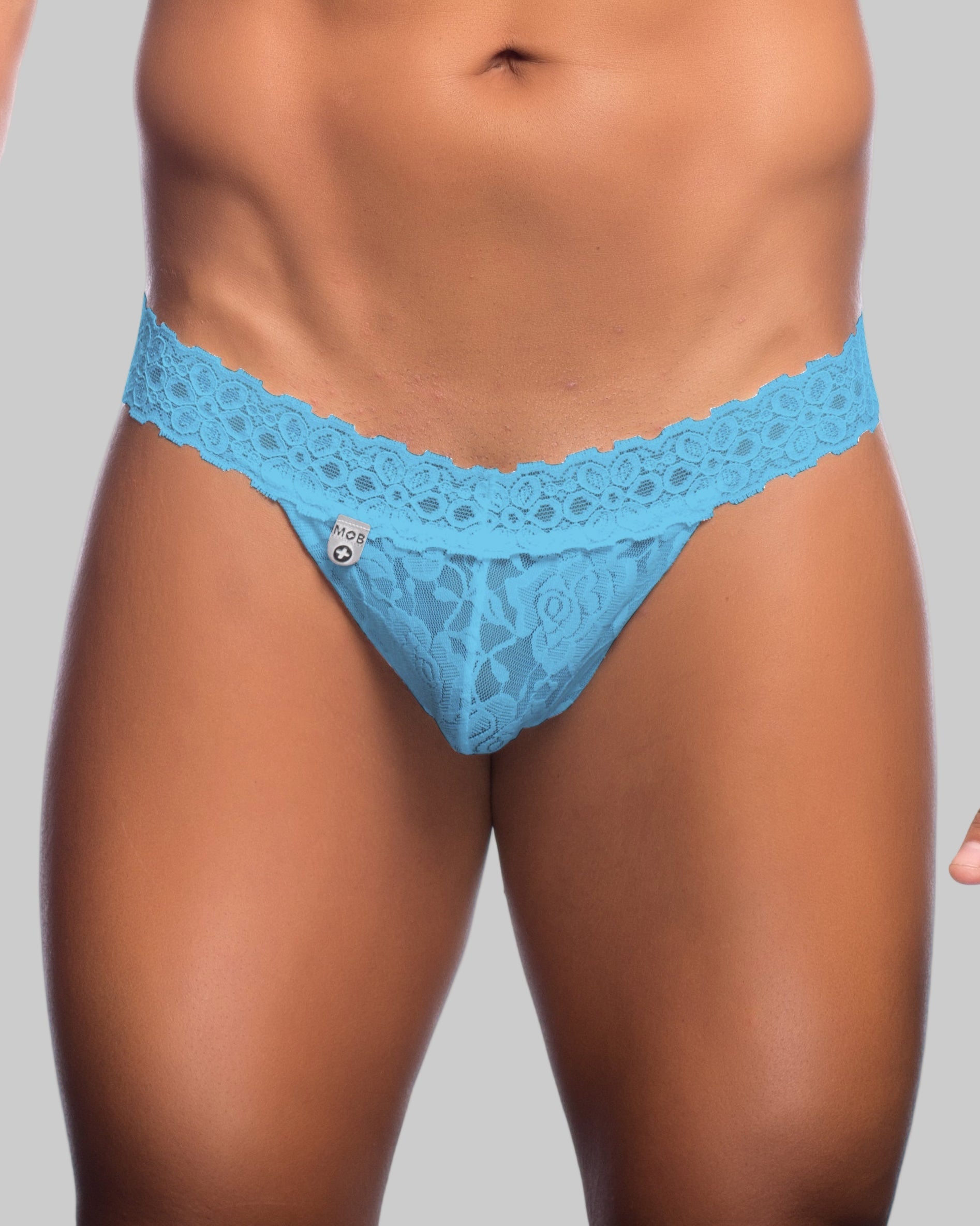 Light blue lace thong with delicate floral pattern and branded tag from mob mens lace waist thong collection