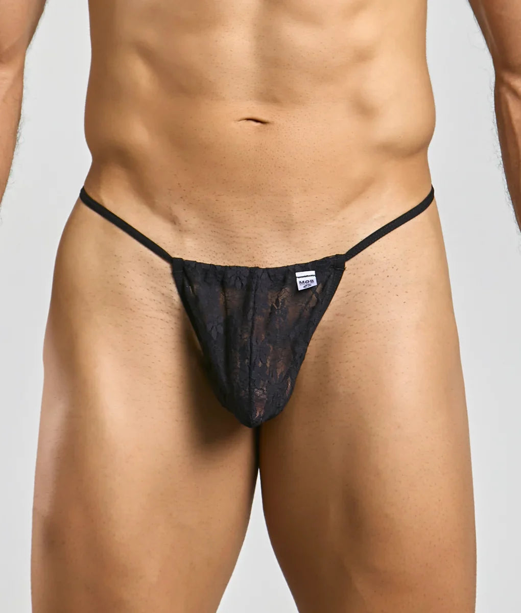 Black lace thong with thin straps and a small brand tag at the waistband from the MOB Print G-String New collection