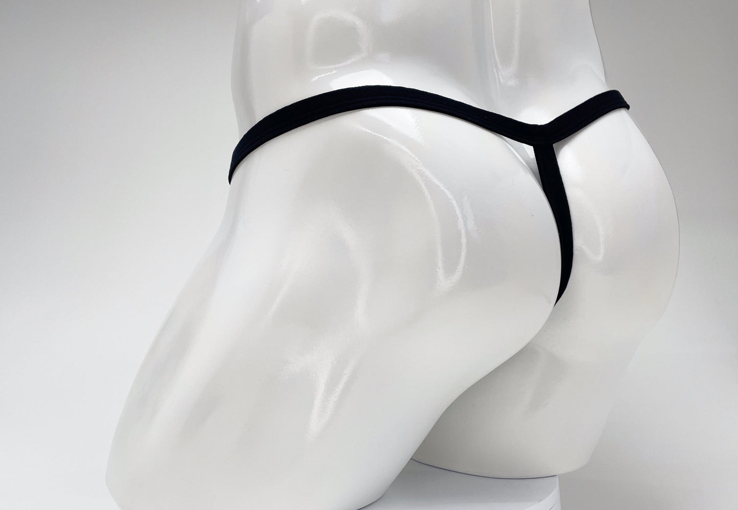 Black WildmanT modal micro thong viewed from the rear on a white mannequin.