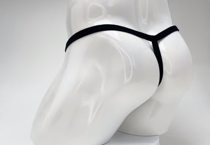Black WildmanT modal micro thong viewed from the rear on a white mannequin.