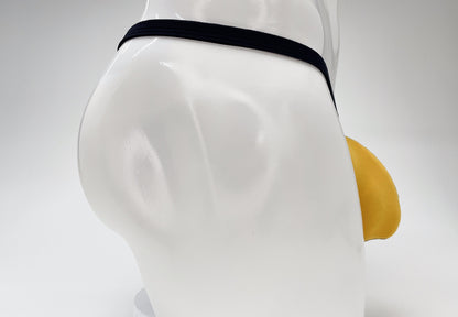 WildmanT gold modal micro thong with a large pouch and thin black waistband on a white mannequin torso.