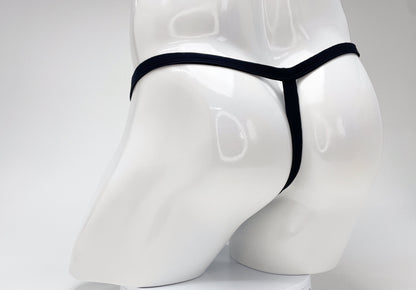 Back view of a WildmanT purple modal micro thong with a thin black waistband on a white mannequin.